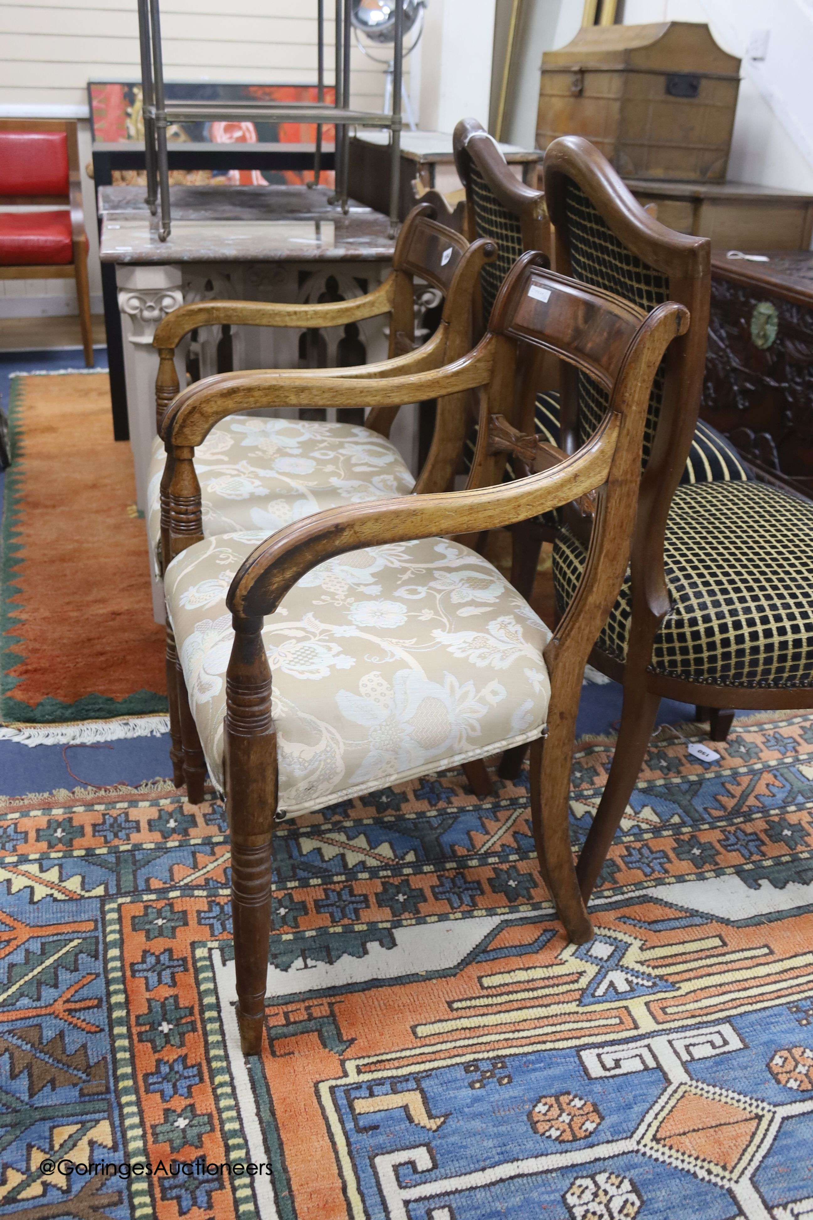 A pair of Regency period mahogany elbow chairs